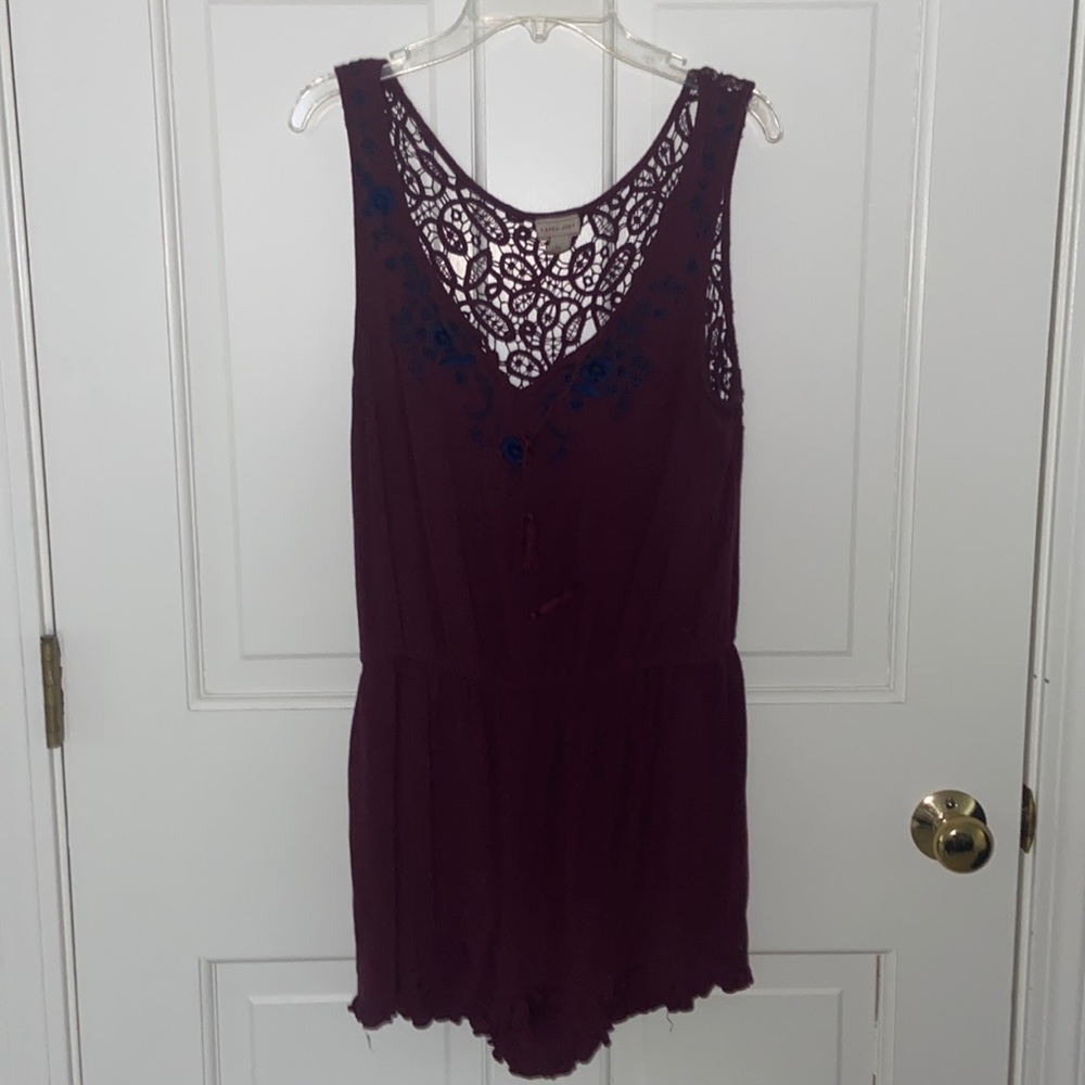 Purple romper with blue floral detailing SIZE: SMALL